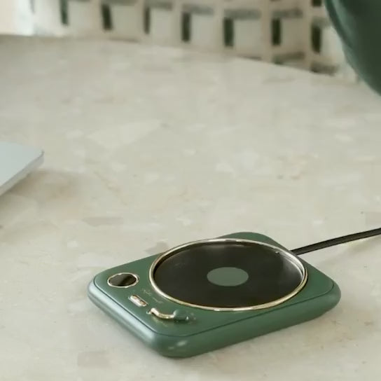 A gif showcasing the mug warmer and candle warmer features of Retro Coaster